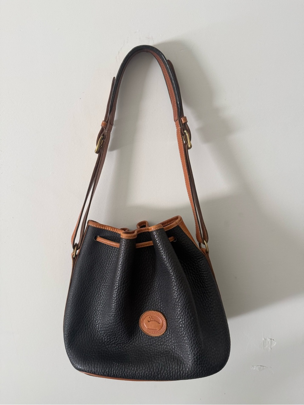 Dooney & Bourke Black Pebble Leather Drawstring Shoulder Bag with Tan Trim